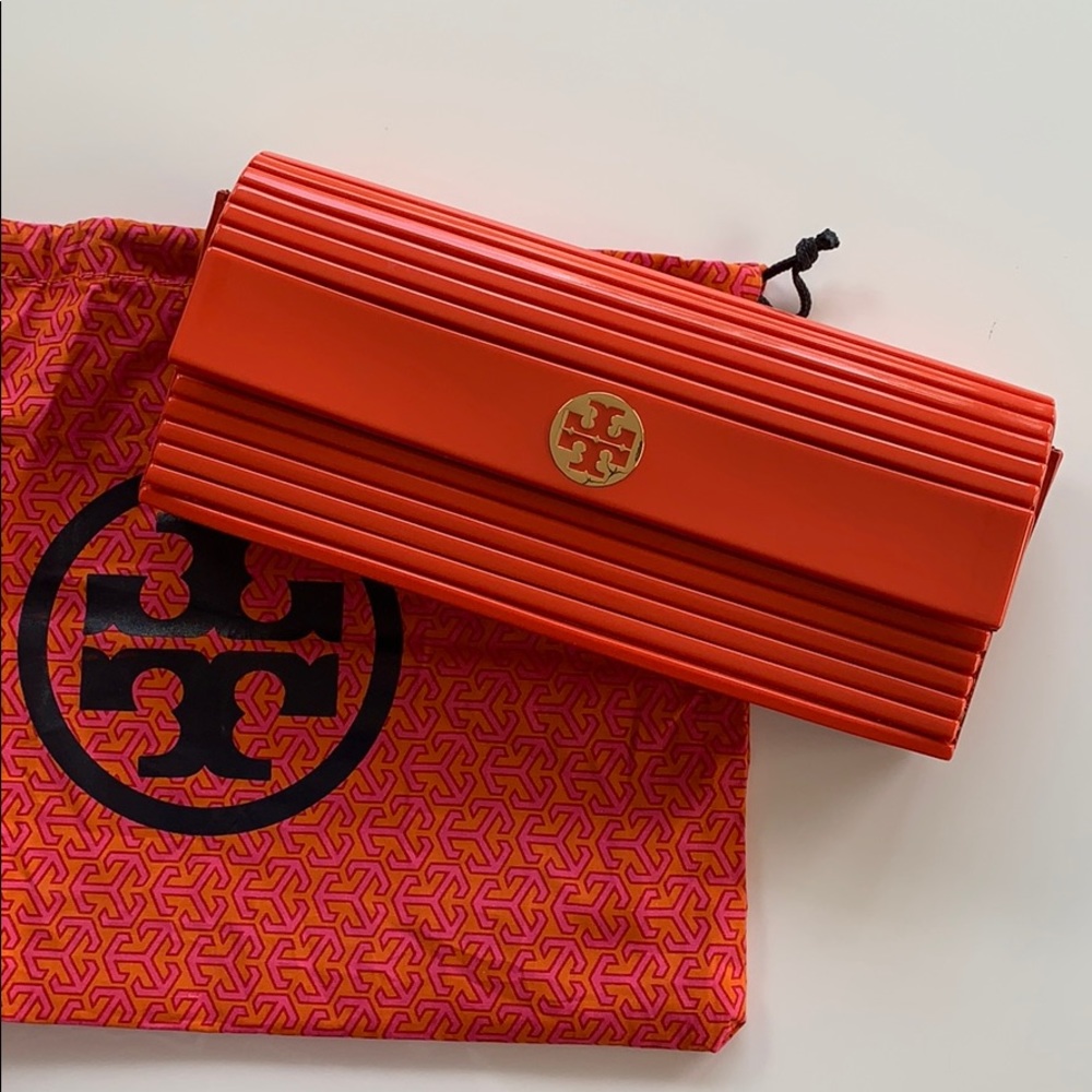 Tory Burch Orange clutch with dust bag.